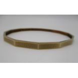 A 9ct gold Greek key pattern bangle, with faceted edges, 8.8 cm wide x 8 cm deep, 17.2 g