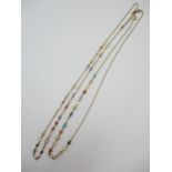 A 15 ct gold multi gem muff chain, with cable links and set with turquoise, moonstone, pearl,