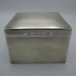 A George V silver cigarette box by Mappin & Webb Ltd, Birmingham 1936, of square form with engine