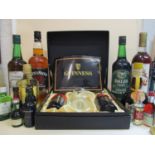 A Guinness presentation case with Toucan Inn Visitor glass and two bottles of Guinness and mixed