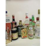 Twelve mixed bottles of spirits to include Gordons dry gin, Kirsch, Drambuie etc