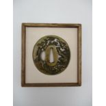 A 19th century Japanese sentoku tsuba signed Noritada, Goto School, modelled with a shishi (guardian