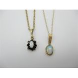 Two 9ct gold box and cable chain necklaces with pendants, one with sapphire cluster and central