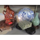 A group of Chinese ceramics and carved wood to include an 18th century blue and white plate together