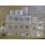 A selection of mainly British coinage and tokens, some silver, to include a 1924 one florin coin,