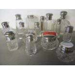 A collection of silver and silver plated topped cut glass dressing table pots (16)