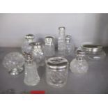 A group of cut glass and silver topped dressing table bottles, a spill vase and other items