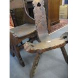 A Victorian gothic style oak chair together with an oak 'birthing' chair