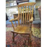A 19th century elm and beech Windsor slat back armchair, turned supports and legs united by H-