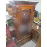 A Victorian mahogany altered wardrobe having a later top with one door and drawer below 208.5cm h