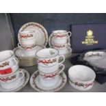 A Royal Worcester Christmas set comprising eight cups and saucers, eight tea plates, a sugar bowl
