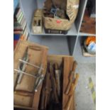 A wooden tool chest containing various wooden woodworking tools to include various planes and