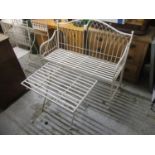 A modern off white painted metal folding garden bench 117cm w and a similar folding table