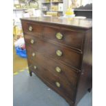 A Georgian mahogany chest of two short and three long drawers on bracket style feet, in two sections