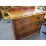 A Victorian mahogany chest of two long and two short drawers above bulbous feet, having a raised