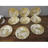 A set of nine Royal Crown Derby Gold Aves pattern plates