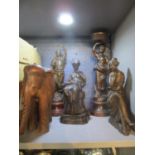 A pair of French patinated spelter figurines mounted on wooden bases two composition bronzed figures