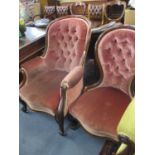 Two Victorian ladies' and gentlemen's mahogany framed and button back armchairs with rose pink