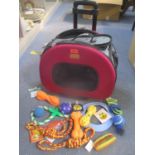 An Ibiyaya dog carrier to include a selection of new dog toys