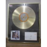 A presentation disc for Oasis album 'Stop the Clock' including signatures of all band members