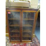 A late Victorian/Edwardian mahogany wall hanging display cabinet with two glazed doors and four