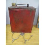 A vintage petrol can, together with a pair of horse spurs
