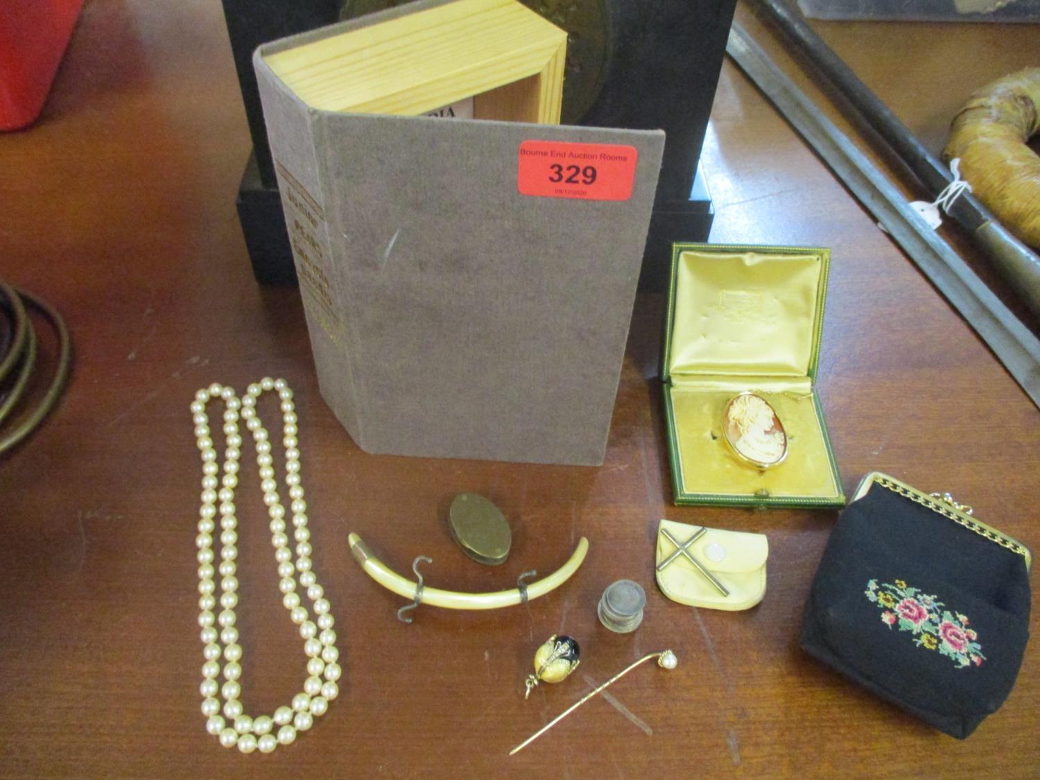 A selection of jewellery and coins to include a shell cameo oval brooch in a yellow metal setting