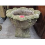 A composition stoneware garden planter raised on a square formed base 44cm h x 51 cm w