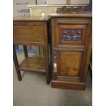 A mahogany bedside pot cupboard/cabinet with raised back and partly carved cupboard door together