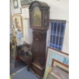 An eight day, four pillar movement and oak cased long case clock having a pendulum and two weights