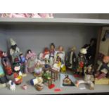 A quantity of worldwide collectors dolls to include Iranian dolls together with a carpet weavers