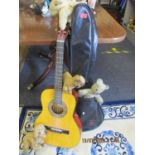 A Palma acoustic guitar with guitar case together with an early 20th Century soft toy of a dog and a