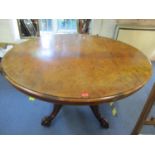 An early Victorian walnut breakfast table, the oval tilt with quartered veneered decoration, on