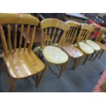 A matched set of six modern pine kitchen chairs with three loose cushions