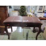 A modern faux leather upholstered piano stool with hinged seat, a walnut dining hair with