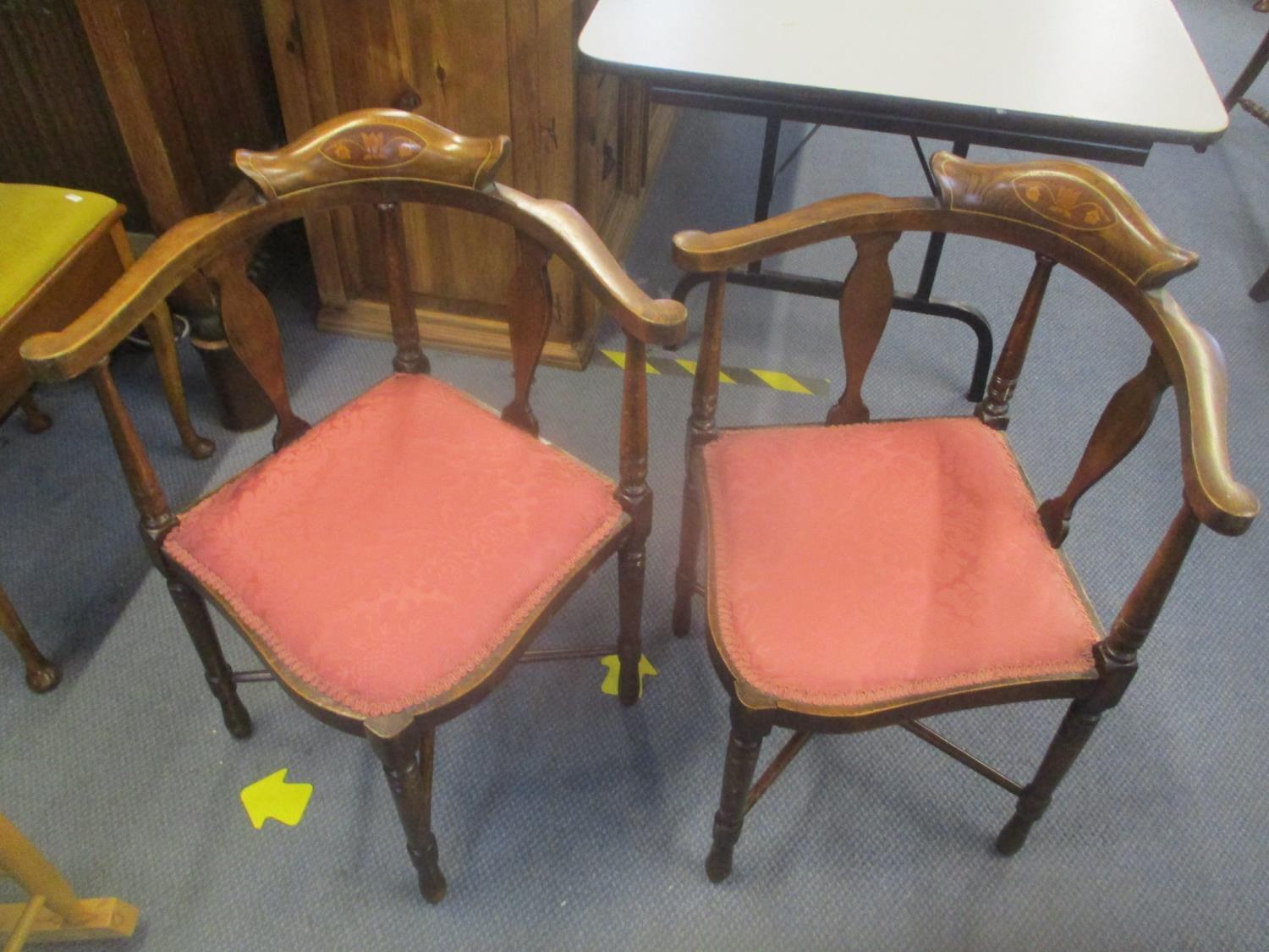 A pair of Edwardian beach and inlaid corner chairs with splat backs on turned legs