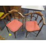 A pair of Edwardian beach and inlaid corner chairs with splat backs on turned legs