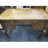 A Georgian oak desk having two long drawers above two short drawers on cabriole legs 78 h x 107 w