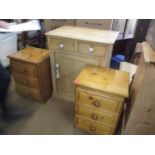 A stripped pine side unit having two small drawers above one cupboard door and three ceramic bun