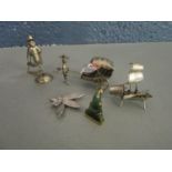 A group of Chinese white metal figurines, a Chinese junk, a 800 silver brooch and a gilded white