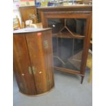 Two mahogany corner cabinets, one being a Georgian wall cabinet with internal shelves and the