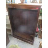 A late 19th/early 20th century mahogany open bookcase having four removeable shelves and on a plinth