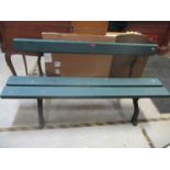 A green painted garden bench with rusticated metal frame and wooden plank seat and back 84cm h x