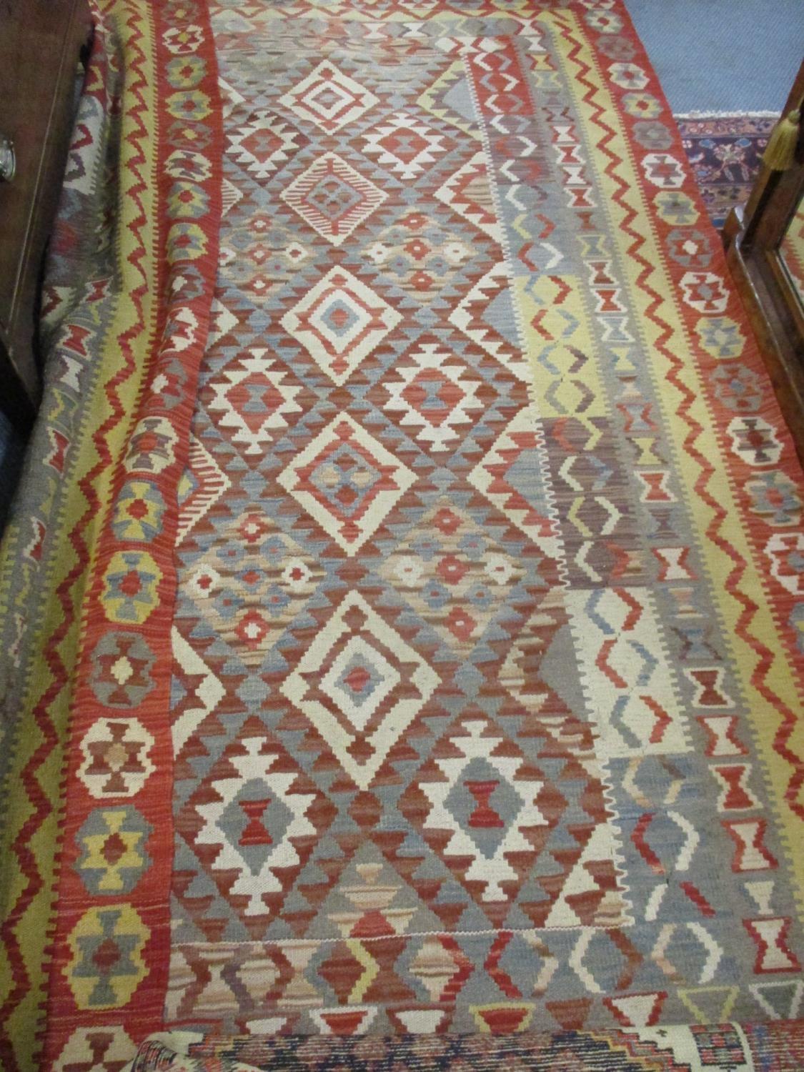 A Kelim rug having a terracotta ground with diamond and geometric design, 167cm x 185cm together - Image 3 of 3