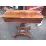 A William IV rosewood foldover card table on a quatrefoil base with turned feet 78cm h x 90.5cm w