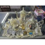 A silver plated four piece tea set on tray with trim handles and a group of Ronson, Veriflame, Polo,