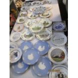 A quantity of collectors plates to include three different Christmas collections comprising Wedgwood