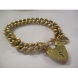 A 9ct gold bracelet having a heart shaped locket, 13g