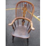 A 19th century satinwood and elm Windsor chair with a pierced splat and spindle back, level arms and