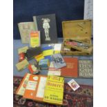 A box containing Kodak plates, drawing and mathematical instruments, typeface related books and